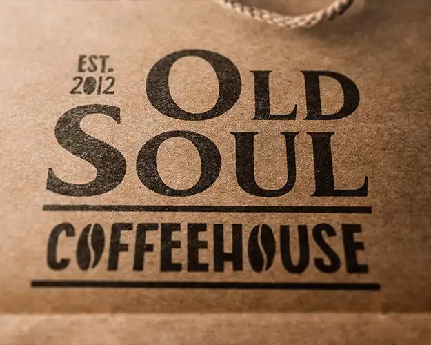 Retro Coffeehouse logo design mocked up on a paper bag.