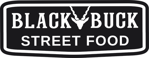 Logo featuring bold, uppercase letters on a black background within an oval border that points down, with a stylised image of a deer's head and antlers centred above the text, which reads 'STREET FOOD'.