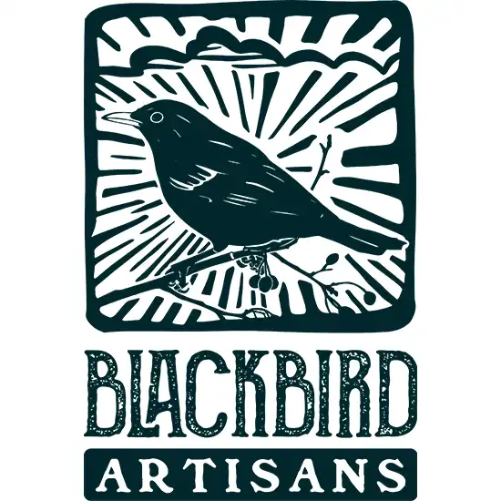 Blackbird Artisans logo featuring a stylised blackbird on a branch with sun rays, designed as part of Coventry logo design services.