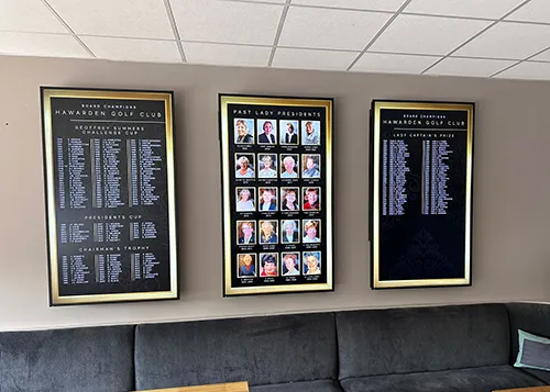 Digital winners' displays designed for a golf club, featuring sleek graphic design with competition winners and past presidents.