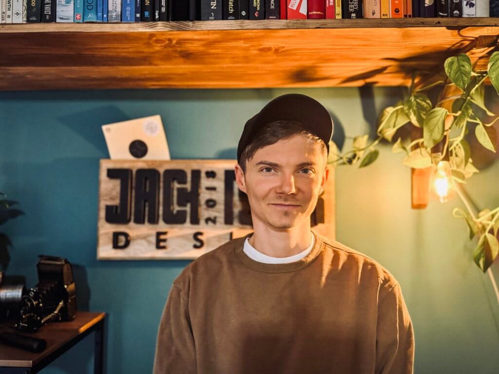 Brand Identity Designer In Coventry stood in his studio smiling