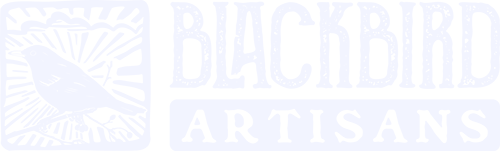 Blackbird Artisans logo featuring a stylised blackbird within a square frame with sunburst and cloud elements, accompanied by bold typography for 'Blackbird' and 'Artisans' below.