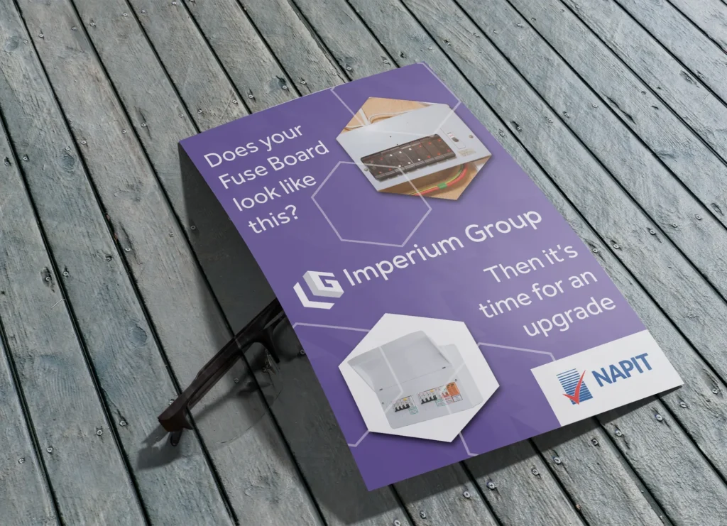 Promotional A-board poster design with a bold purple background, showcasing a fuse board upgrade message alongside before-and-after imagery and industry accreditation.