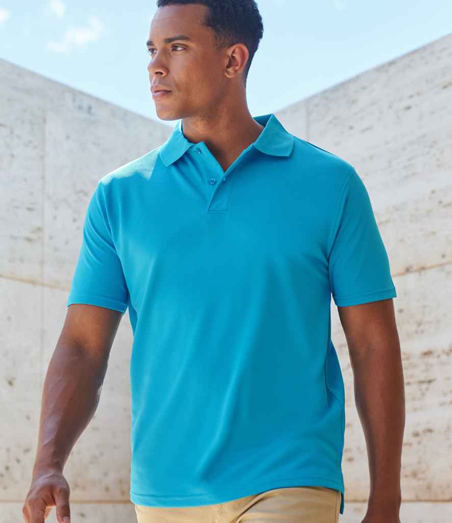 Man wearing a plain turquoise polo shirt, ideal for custom embroidery or logo printing—popular choice for uniforms or branded workwear.