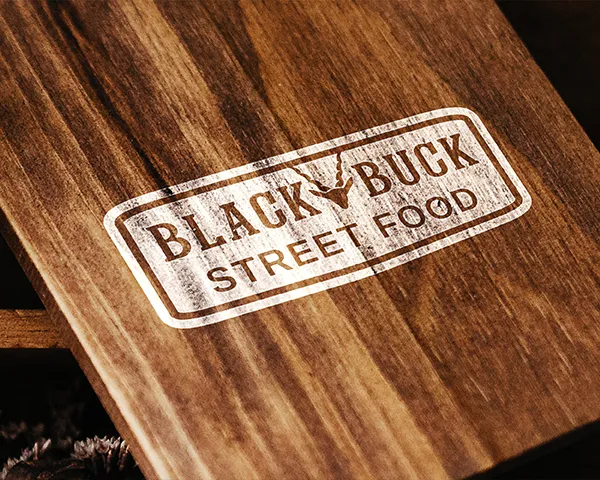 Black Buck Street Food logo stamped on rustic wooden surface – vintage-style branding for coventry based food truck or street food business