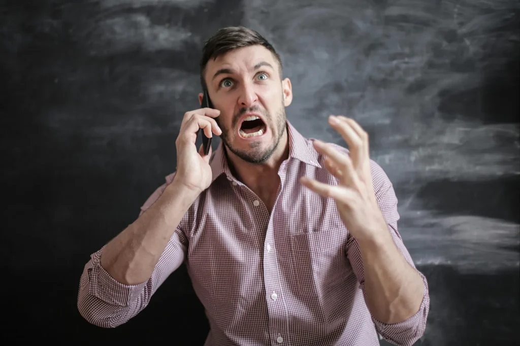 Frustrated business owner dealing with poor client enquiries caused by weak branding