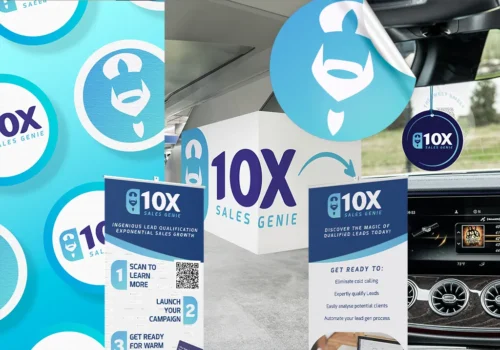 Sales business brand materials shown across stickers, exhibition stands, signage and car air freshener mockups.